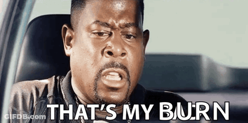 A Man With A Beard Is Sitting In A Car With The Words `` That 'S My Burn '' Written On The Screen . GIF