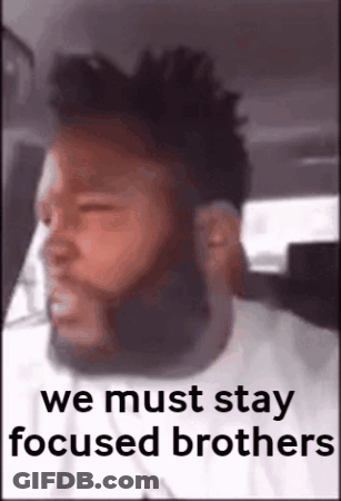 A Man With A Beard Is Sitting In A Car With The Words We Must Stay Focused Brothers Above Him GIF