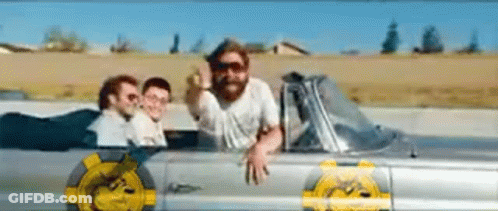 A Man With A Beard Is Sitting In A Car With Two Other Men . GIF