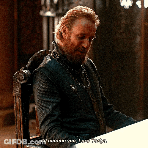 A Man With A Beard Is Sitting In A Chair And Says " I 'Ll Caution You Lord Corlys " GIF