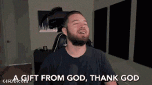 A Man With A Beard Is Sitting In A Chair With His Eyes Closed And Says A Gift From God Thank God GIF