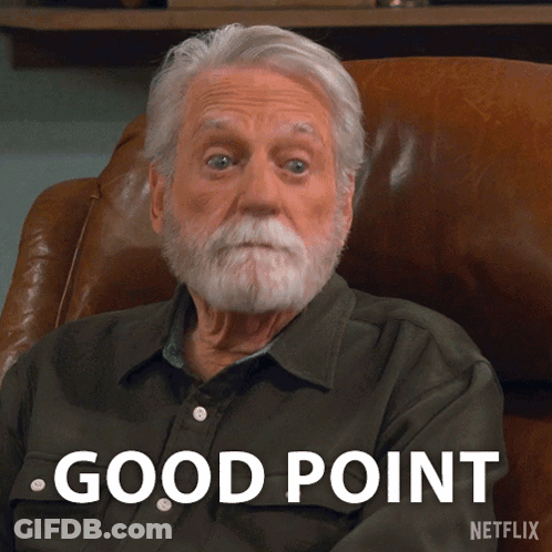 A Man With A Beard Is Sitting In A Chair With The Words Good Point Written On The Bottom GIF