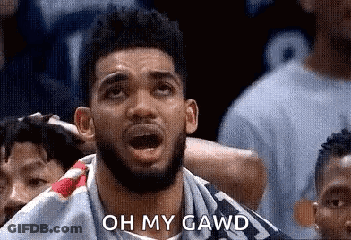 A Man With A Beard Is Sitting In A Crowd Watching A Basketball Game And Saying `` Oh My Gawd '' . GIF