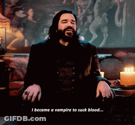 A Man With A Beard Is Sitting In Front Of A Candle And Says I Became A Vampire To Suck Blood ... GIF