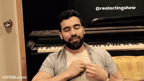 A Man With A Beard Is Sitting In Front Of A Piano With The Hashtag @Realactingshow GIF