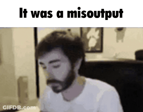 A Man With A Beard Is Sitting In Front Of A Screen That Says It Was A Misooutput GIF