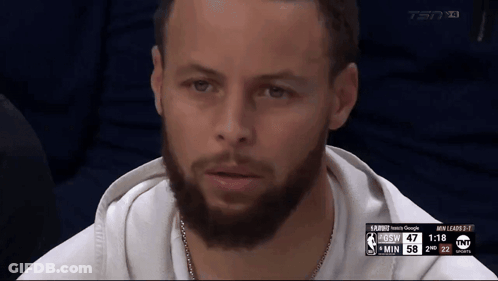 A Man With A Beard Is Sitting In Front Of A Screen That Says Tsn On It GIF