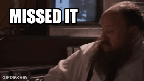 A Man With A Beard Is Sitting In Front Of A Tv With The Words Missed It Above Him GIF