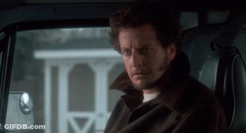 A Man With A Beard Is Sitting In The Back Seat Of A Vehicle GIF