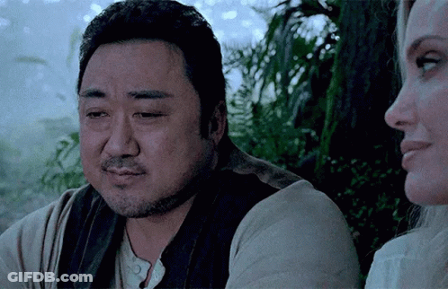 A Man With A Beard Is Sitting Next To A Woman In A Movie . GIF