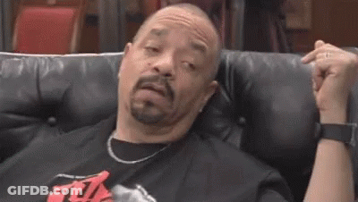 Man With Beard Making Funny Face On Couch GIF