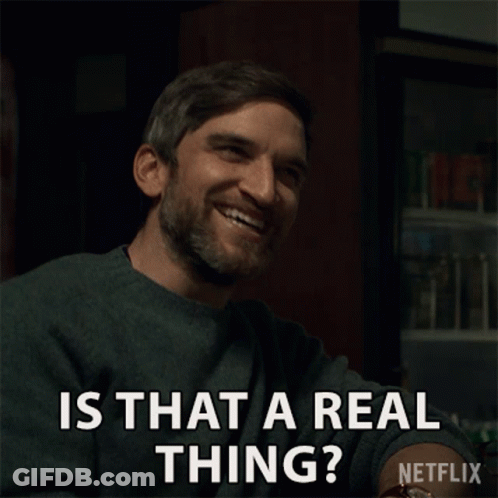 A Man With A Beard Is Smiling And Asking Is That A Real Thing GIF