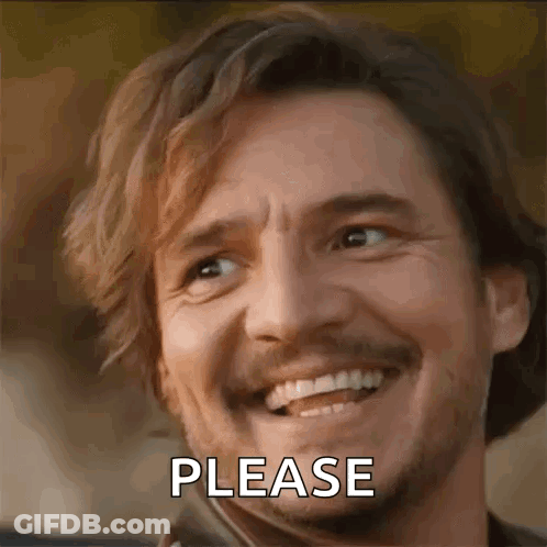 A Man With A Beard Is Smiling And Making A Please Sign . GIF