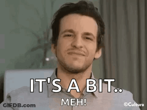 A Man With A Beard Is Smiling And Saying `` It 'S A Bit Meh ! '' GIF