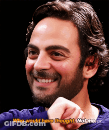 A Man With A Beard Is Smiling And Says " Who Would Have Thought Not Me " GIF