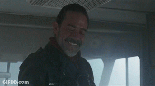 A Man With A Beard Is Smiling And Wearing A Jacket That Says ' Abercrombie & Fitch ' On It GIF