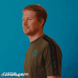A Man With A Beard Is Smiling In Front Of A Blue Background With Simonegifs Written On The Bottom GIF