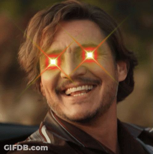 A Man With A Beard Is Smiling With Red Eyes GIF