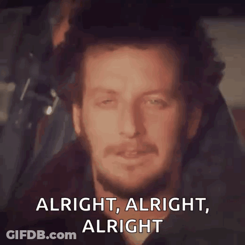 A Man With A Beard Is Smiling With The Words Alright Alright Alright GIF