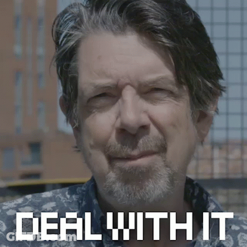 A Man With A Beard Is Smiling With The Words Deal With It Behind Him GIF
