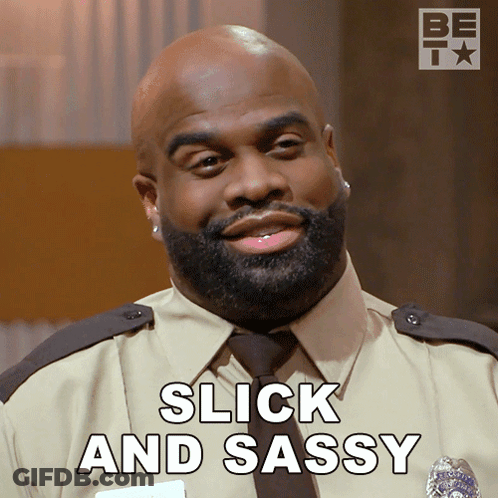 A Man With A Beard Is Smiling With The Words Slick And Sassy Behind Him GIF