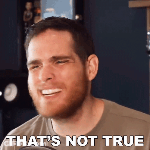 A Man With A Beard Is Smiling With The Words That 'S Not True Behind Him GIF