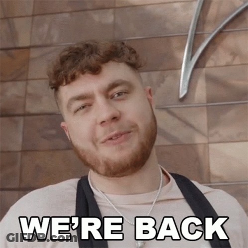 Man Smiling With Were Back Below GIF