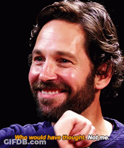 A Man With A Beard Is Smiling With The Words Who Would Have Thought Not Me Below Him GIF