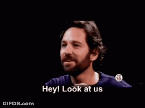 A Man With A Beard Is Smiling With The Words Who Would 'Ve Thought Not Me Below Him GIF