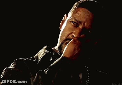A Man With A Beard Is Smoking A Cigarette And Has Blood On His Shirt GIF