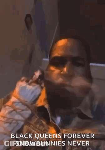 A Man With A Beard Is Smoking A Cigarette And Says `` Black Queens Forever Snowbunnies Never '' GIF