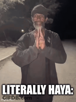 A Man With A Beard Is Smoking A Cigarette And The Caption Literally Haya GIF