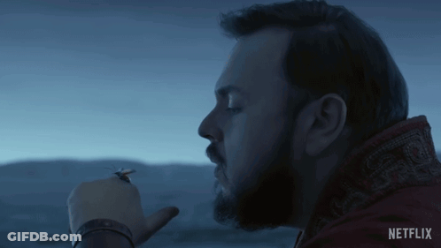 Bearded Man Smoking Cigarette In Front Of Sky GIF