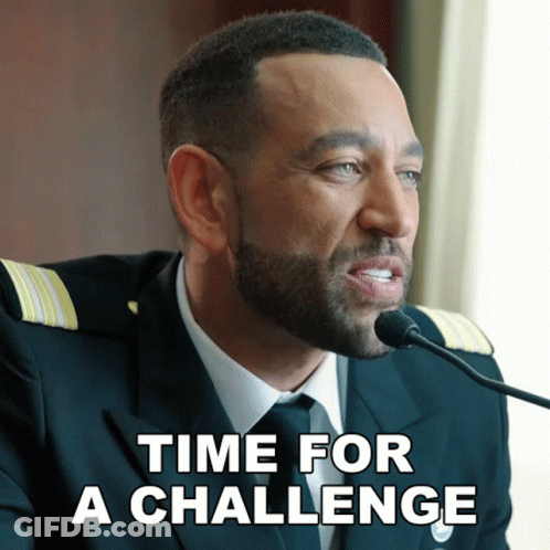 A Man With A Beard Is Speaking Into A Microphone With The Words Time For A Challenge Below Him GIF