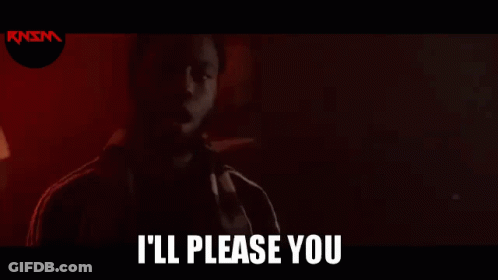 A Man With A Beard Is Standing In A Dark Room With The Words `` I 'Ll Please You '' Written Above Him . GIF
