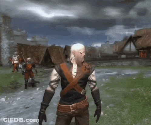 A Man With A Beard Is Standing In A Field With Soldiers In The Background GIF