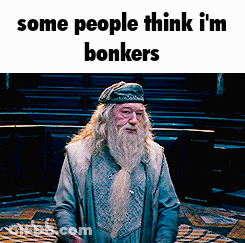A Man With A Beard Is Standing In A Room With The Words Some People Think I 'M Bonkers On The Bottom GIF