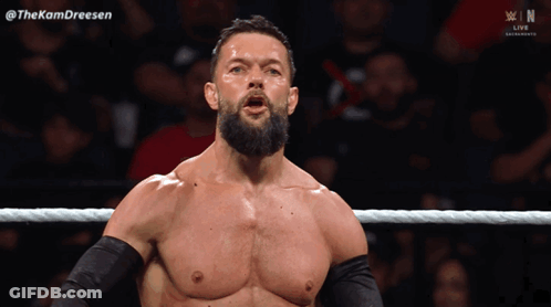 A Man With A Beard Is Standing In A Wrestling Ring With The Hashtag Thekamdreesen GIF