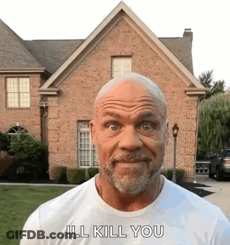 A Man With A Beard Is Standing In Front Of A Brick House And Says `` Ill Kill You '' . GIF