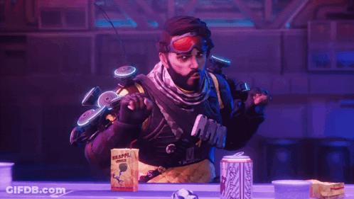A Man With A Beard Is Standing In Front Of A Can Of Coca Cola GIF