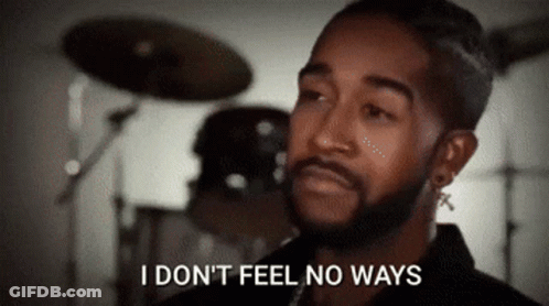 A Man With A Beard Is Standing In Front Of A Drum Set And Saying I Don 'T Feel No Ways . GIF
