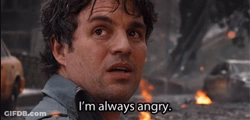 A Man With A Beard Is Standing In Front Of A Fire And Says `` I 'M Always Angry '' . GIF