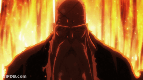 A Man With A Beard Is Standing In Front Of A Fire Background GIF