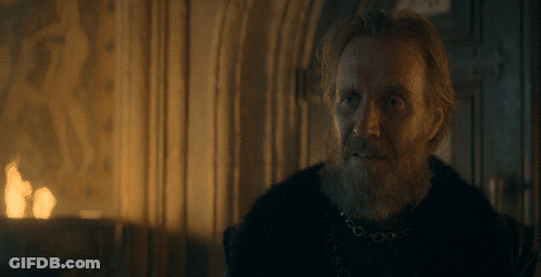 A Man With A Beard Is Standing In Front Of A Fire With The Words You Above Him GIF