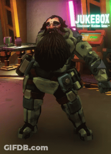 A Man With A Beard Is Standing In Front Of A Jukebox Sign GIF
