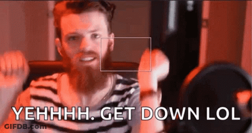 A Man With A Beard Is Standing In Front Of A Microphone And Saying Get Down Lol GIF