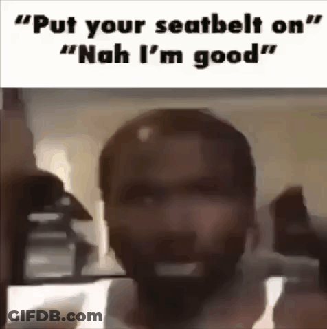 A Man With A Beard Is Standing In Front Of A Mirror With The Words `` Put Your Seatbelt On '' Written On It . GIF