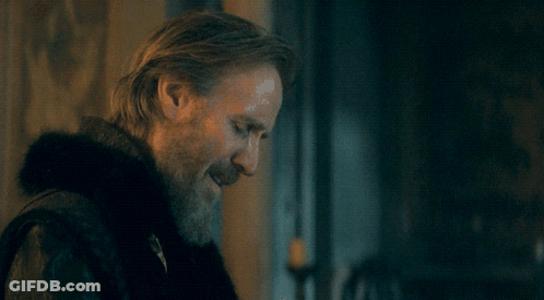 A Man With A Beard Is Standing In Front Of A Poster That Says Is That What You Think GIF