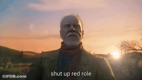 A Man With A Beard Is Standing In Front Of A Sunset And Says Shut Up Red Role GIF