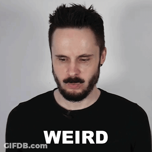Man With Beard Standing In Front Of Weird Background GIF